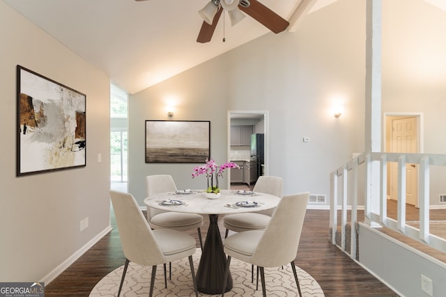 6255 Saddlewood Dr, Lithonia, GA 30058 - dining space with a ceiling fan, dark wood-style flooring, high vaulted ceiling, and stairway