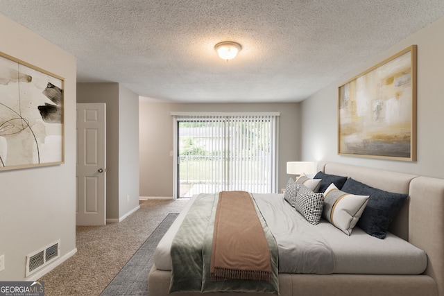 6255 Saddlewood Dr, Lithonia, GA 30058 - bedroom featuring carpet floors and a textured ceiling