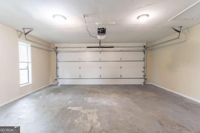 6255 Saddlewood Dr, Lithonia, GA 30058 - garage featuring baseboards and a garage door opener