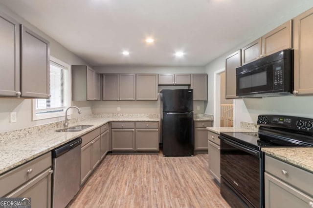 6255 Saddlewood Dr, Lithonia, GA 30058 - kitchen featuring black appliances, gray cabinets, light wood-style flooring, and recessed lighting
