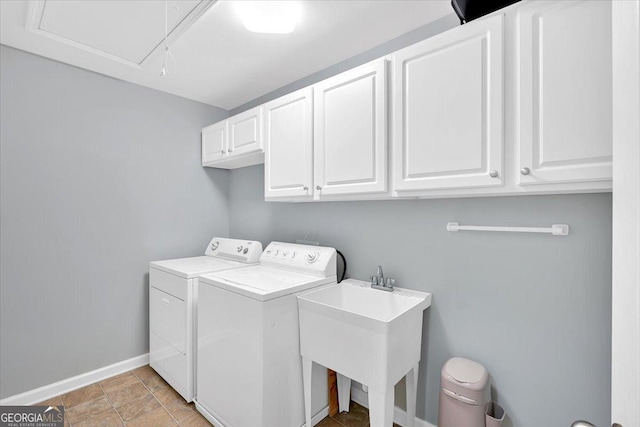 laundry area with cabinet space, washer and dryer, baseboards, and attic access