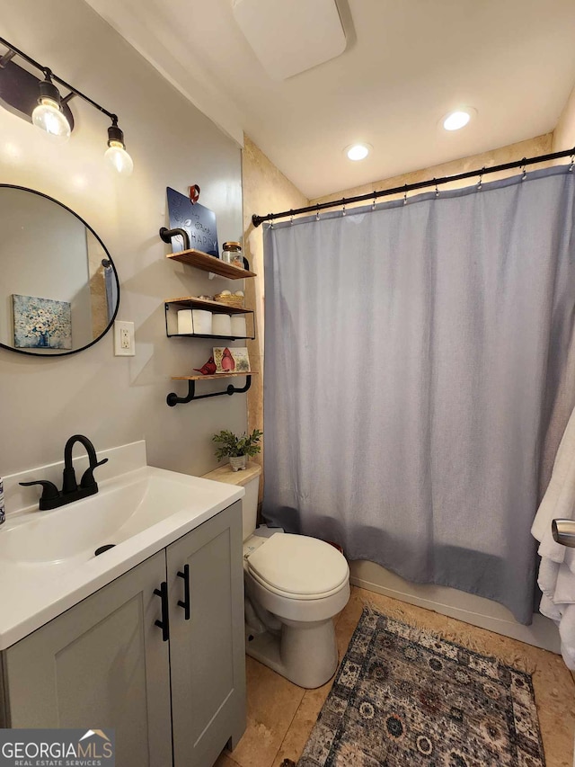 bathroom featuring vanity, recessed lighting, shower / bath combo, and toilet