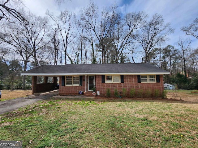 single story home with brick siding, driveway, a front lawn, and an attached carport