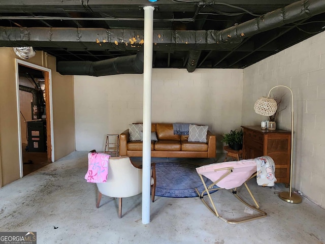 unfinished basement with concrete block wall