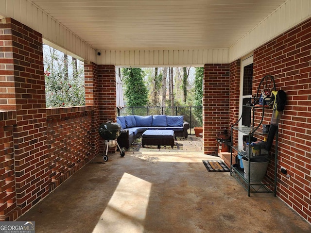 view of patio / terrace with area for grilling, fence, and an outdoor living space