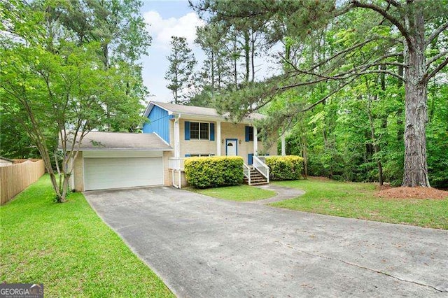 3003 Butler Creek Rd NW, Kennesaw, GA 30152 - bi-level home featuring fence, a front yard, driveway, and a garage