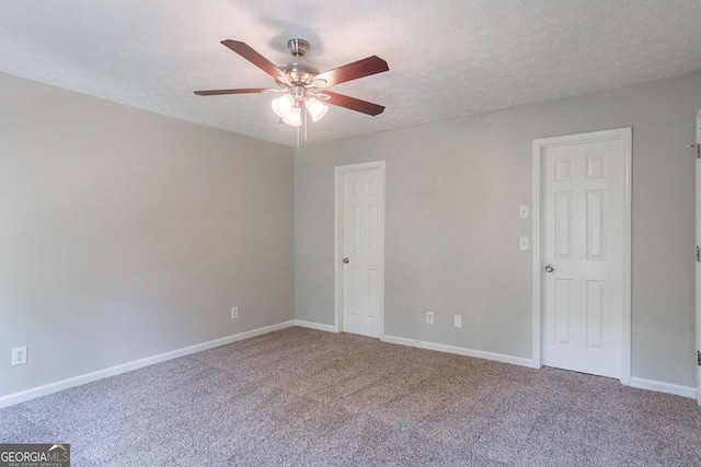 5028 Nichols Dr, Flowery Branch, GA 30542 - empty room featuring ceiling fan, carpet flooring, and a textured ceiling