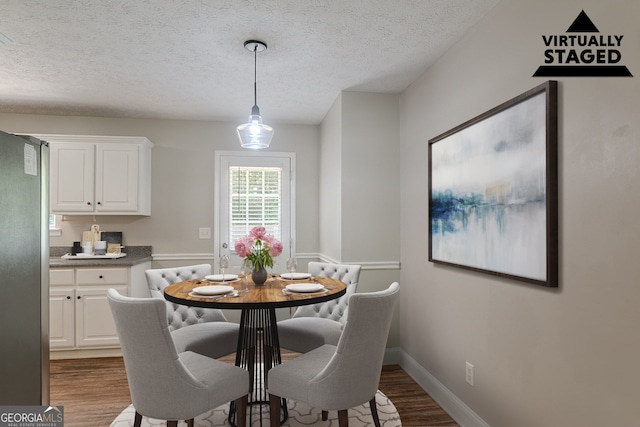 5028 Nichols Dr, Flowery Branch, GA 30542 - dining space with wood finished floors and a textured ceiling