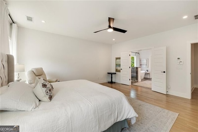 bedroom featuring light wood-style flooring, baseboards, and visible vents