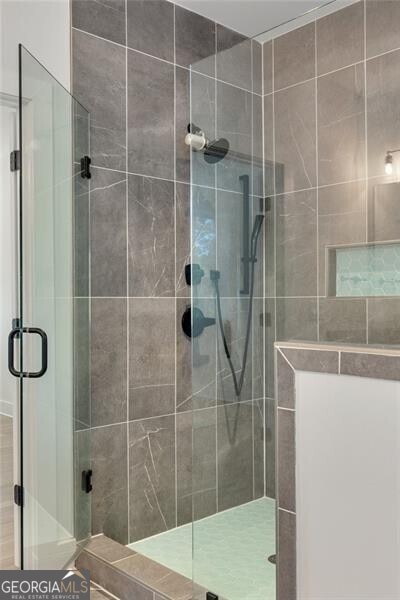full bathroom with a shower stall