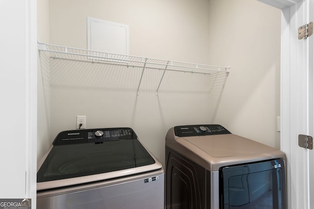 washroom with laundry area and washer and dryer