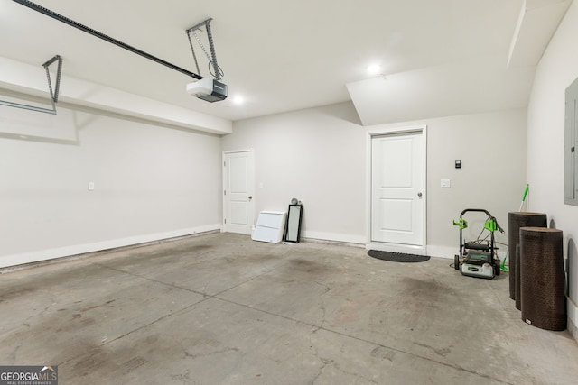 garage with baseboards and a garage door opener