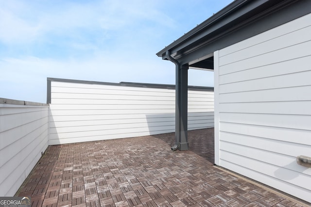 view of patio / terrace featuring fence