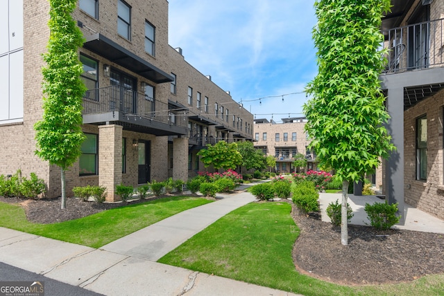view of community featuring a lawn