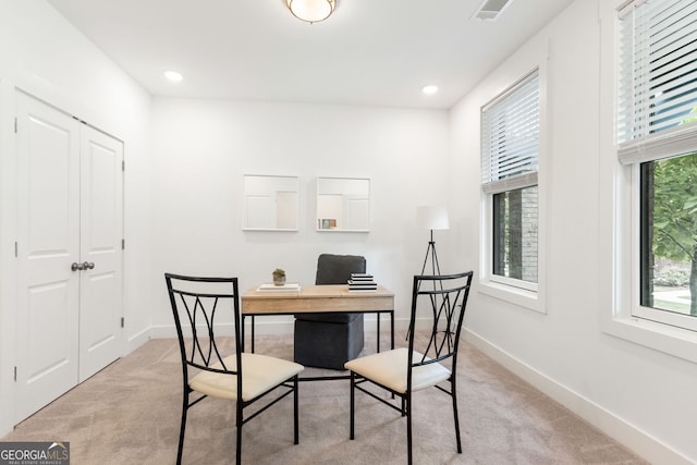 carpeted office space featuring baseboards, recessed lighting, and visible vents