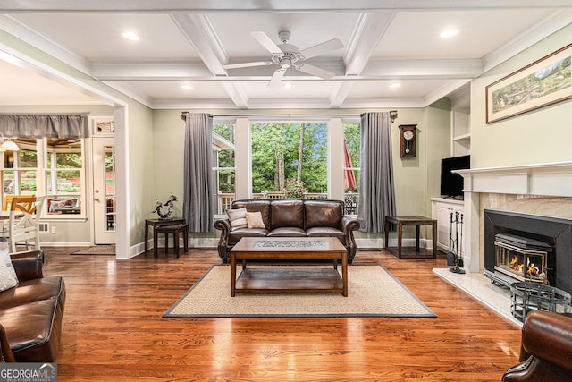 139 Ardsley Run, Canton, GA 30115 - living area featuring ceiling fan, a high end fireplace, beam ceiling, coffered ceiling, and ornamental molding