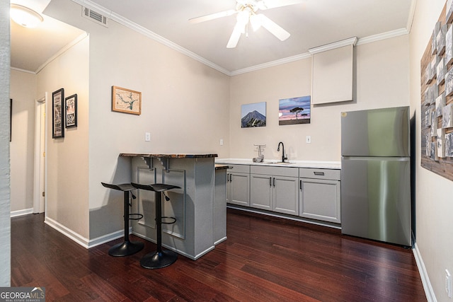 139 Ardsley Run, Canton, GA 30115 - bar with freestanding refrigerator, dark wood finished floors, crown molding, and ceiling fan