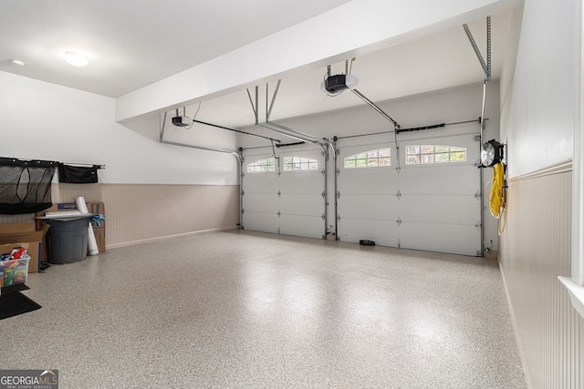 139 Ardsley Run, Canton, GA 30115 - garage featuring a garage door opener and wainscoting