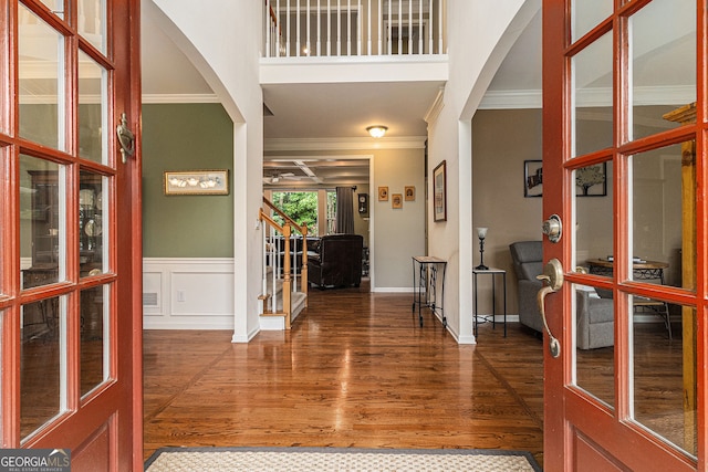 139 Ardsley Run, Canton, GA 30115 - foyer with arched walkways, ornamental molding, wood finished floors, stairway, and wainscoting