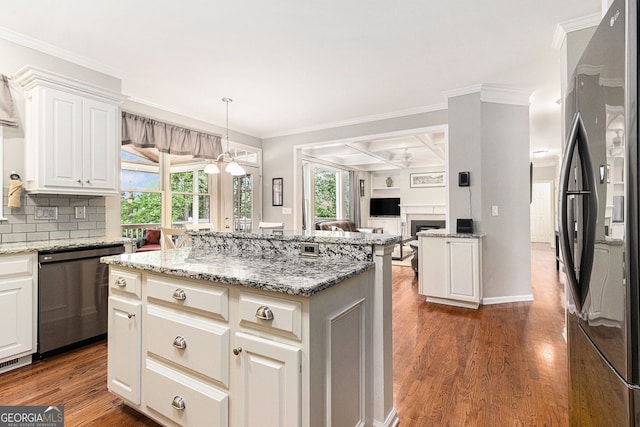 139 Ardsley Run, Canton, GA 30115 - kitchen featuring appliances with stainless steel finishes, a center island, ornamental molding, wood finished floors, and coffered ceiling