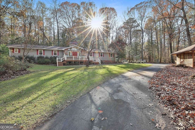 337 Andrew Bailey Rd, Sharpsburg, GA 30277 - ranch-style house with a deck, a front yard, and asphalt driveway