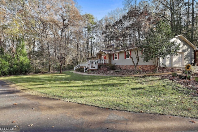 337 Andrew Bailey Rd, Sharpsburg, GA 30277 - view of front of house with a front lawn, a chimney, and a garage