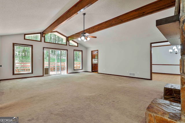 337 Andrew Bailey Rd, Sharpsburg, GA 30277 - unfurnished living room featuring carpet floors, ceiling fan, a chandelier, a wood stove, and a textured ceiling
