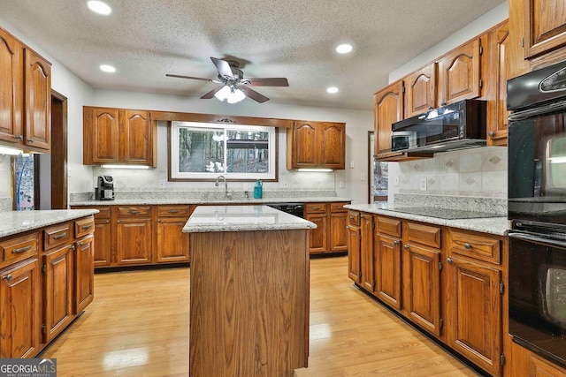 337 Andrew Bailey Rd, Sharpsburg, GA 30277 - kitchen featuring black appliances, ceiling fan, decorative backsplash, brown cabinetry, and recessed lighting
