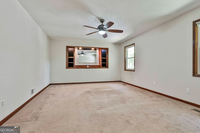 337 Andrew Bailey Rd, Sharpsburg, GA 30277 - empty room featuring a textured ceiling, ceiling fan, and carpet flooring