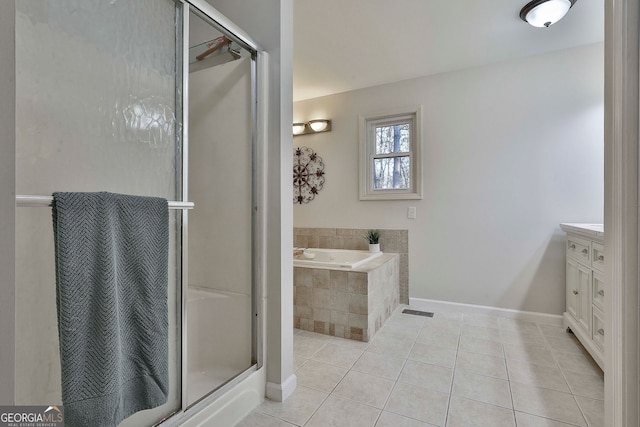 337 Andrew Bailey Rd, Sharpsburg, GA 30277 - bathroom with a garden tub, vanity, tile patterned flooring, and a shower stall