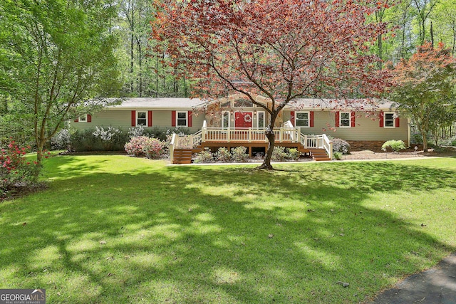 337 Andrew Bailey Rd, Sharpsburg, GA 30277 - manufactured / mobile home featuring stairs, a deck, and a front lawn