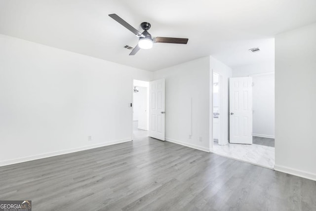 522 Wilderness Dr, Macon, GA 31220 - unfurnished bedroom featuring wood finished floors, baseboards, and ceiling fan