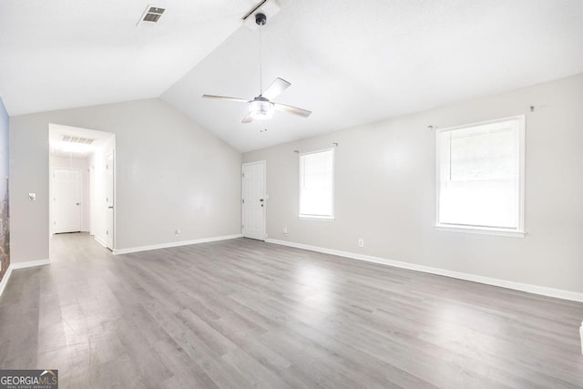 522 Wilderness Dr, Macon, GA 31220 - unfurnished living room featuring ceiling fan, vaulted ceiling, wood finished floors, and baseboards