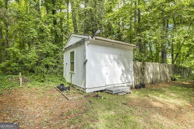 522 Wilderness Dr, Macon, GA 31220 - view of shed with fence and a wooded view