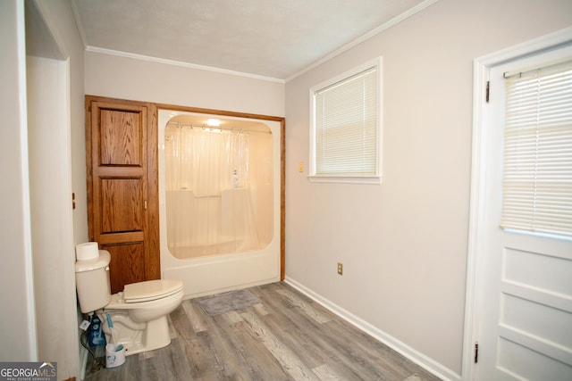 603 E Main St, Thomaston, GA 30286 - full bathroom with wood finished floors, toilet, baseboards, crown molding, and shower / bath combination with curtain