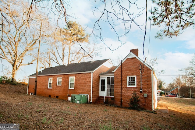 603 E Main St, Thomaston, GA 30286 - back of house with a chimney, brick siding, entry steps, crawl space, and central AC unit