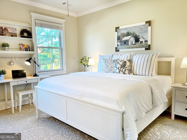bedroom with crown molding, carpet flooring, and visible vents