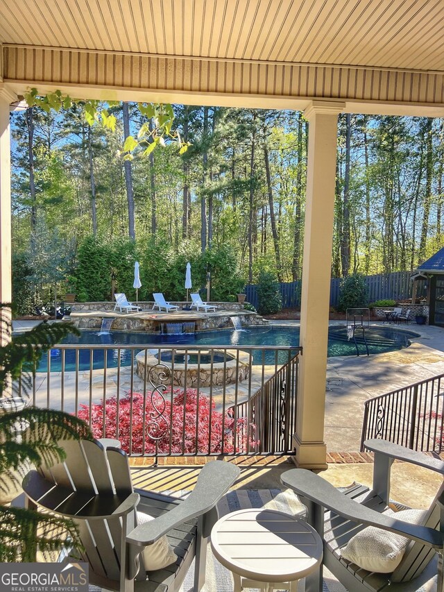 view of patio / terrace featuring a fenced in pool and fence