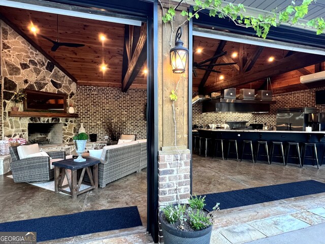 view of patio with an outdoor kitchen and an outdoor bar