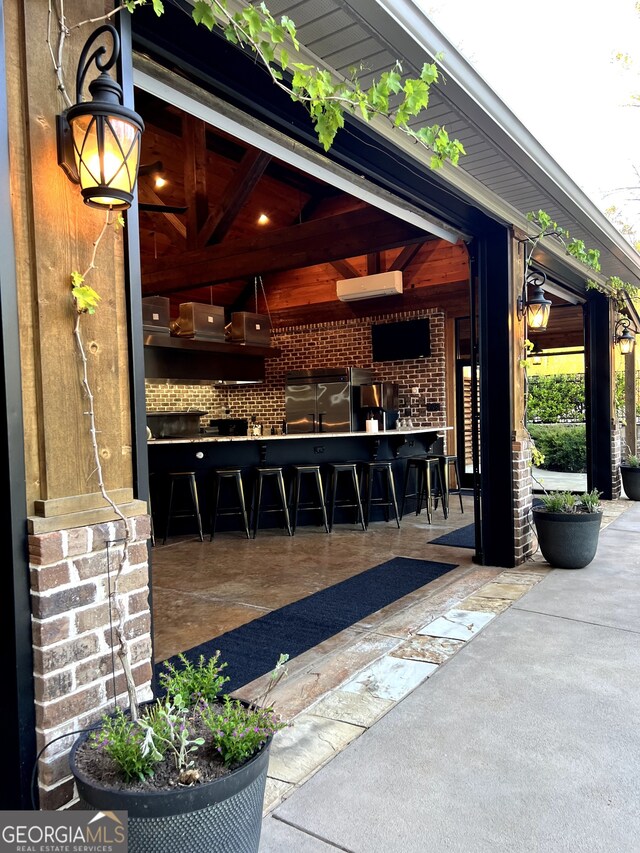 view of patio / terrace with an outdoor bar