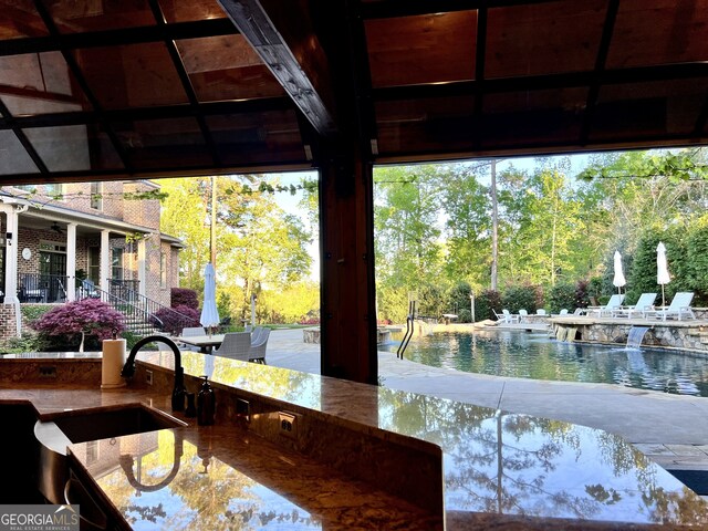 exterior space with a water view and a sink
