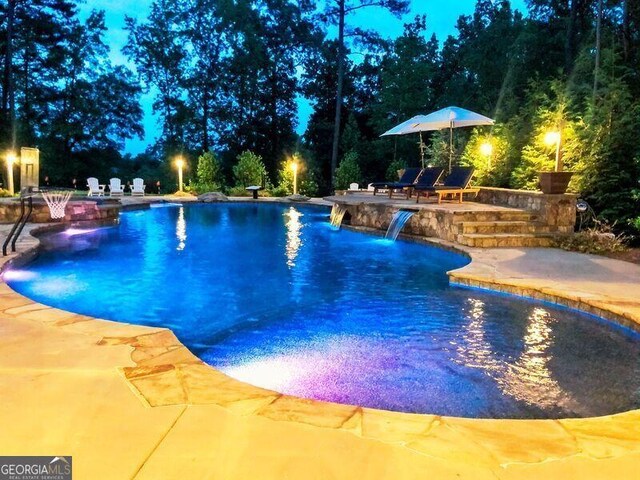 outdoor pool with a patio area