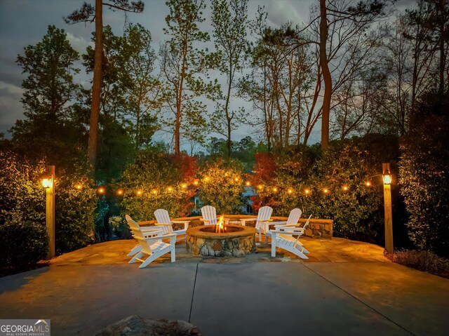 view of patio / terrace with an outdoor fire pit