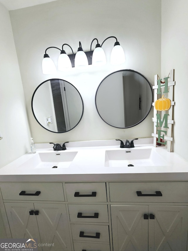 bathroom featuring double vanity and a sink