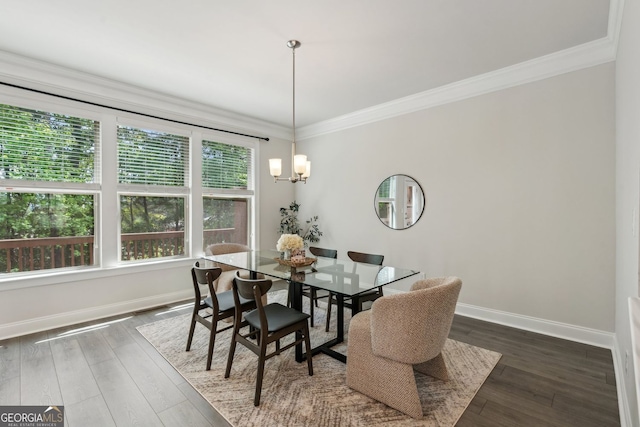 dining area featuring baseboards, dark wood-style floors, and ornamental molding