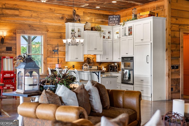290 Weldon Rd, Fayetteville, GA 30215 - living room featuring recessed lighting, a chandelier, wooden walls, and a toaster