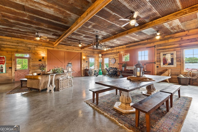290 Weldon Rd, Fayetteville, GA 30215 - dining area with a ceiling fan, concrete flooring, wooden walls, and a wealth of natural light
