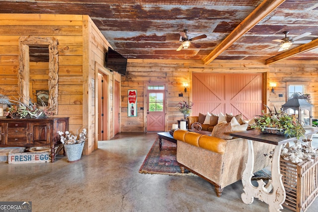 290 Weldon Rd, Fayetteville, GA 30215 - living area with a ceiling fan, beamed ceiling, wood walls, and concrete floors