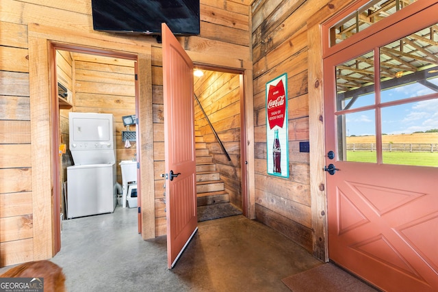 290 Weldon Rd, Fayetteville, GA 30215 - interior space featuring wooden walls, stacked washer / drying machine, and finished concrete floors