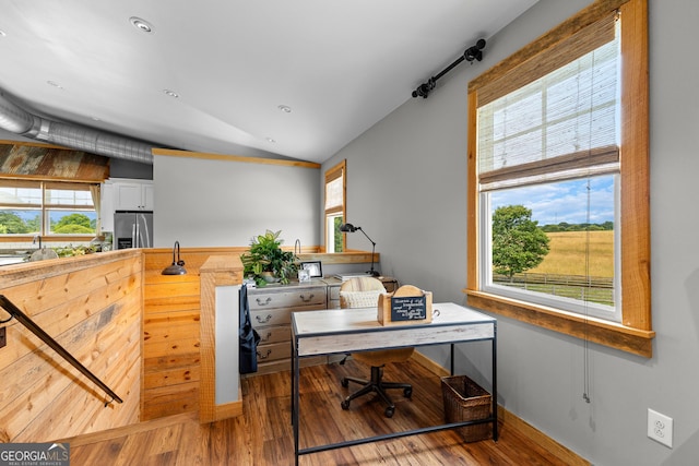 290 Weldon Rd, Fayetteville, GA 30215 - office area with vaulted ceiling, a healthy amount of sunlight, and wood finished floors